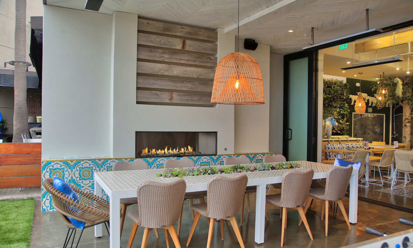 J Series by European Home: Outdoor gas fireplace at Mendocino Farms.